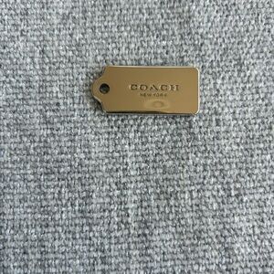 Coach Silver Tag